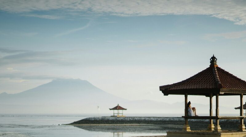 brown gazebo near sea closeup photography